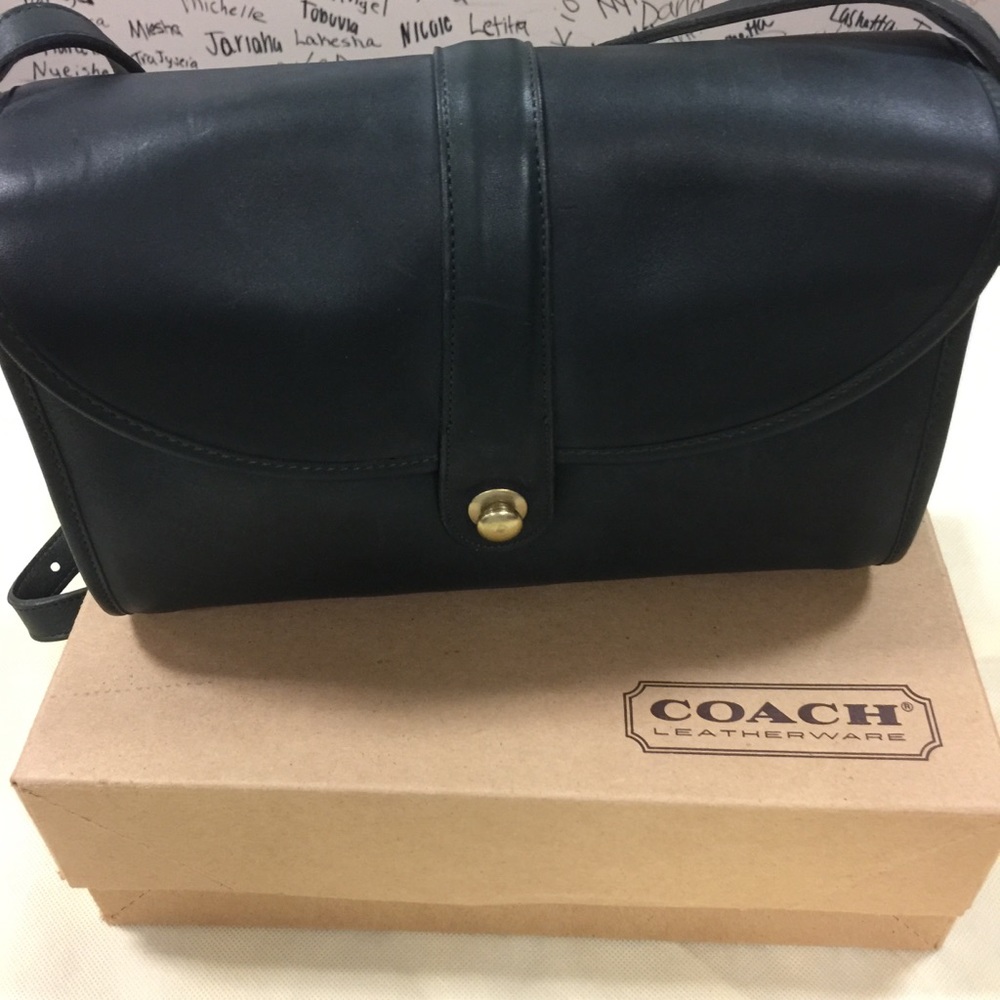 Dark green leather Coach roll bag